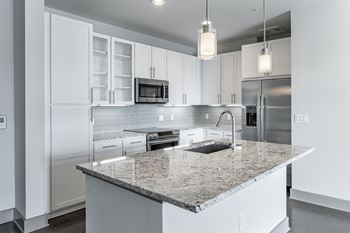 Granite countertops w/ tile backsplash